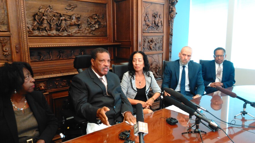 Charleena Lyles' father, Charles Lyles, with his wife and attorneys