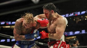 Julio Cesar Chavez Jr., right, punches Jake Paul during their cruiserweight boxing match on Saturday, June 28, 2025, in Anaheim, Calif. (AP Photo/Etienne Laurent)