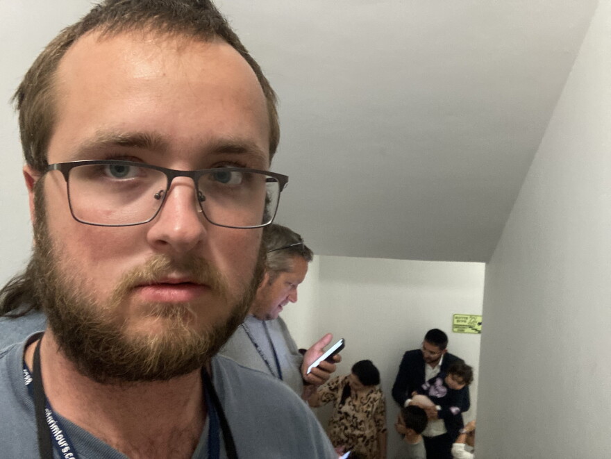 Peters and his family took shelter in a stairwell while explosions sounded outside of his Jerusalem hotel. He is pictured here with an Israeli family who sought refuge after their home was destroyed.