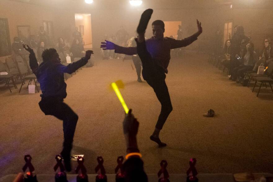 Competitors vogue at the Red Ribbon Rumble in Indianapolis, Friday, Nov. 3, 2017.