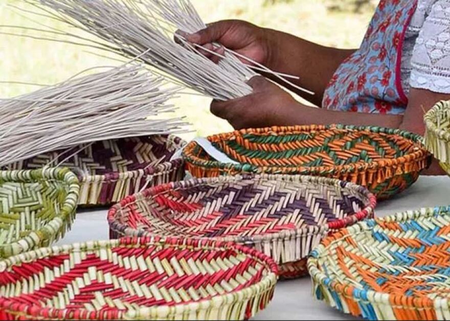 Tribal artisan working on baskets at the Desert View Watchtower at Grand Canyon National Park