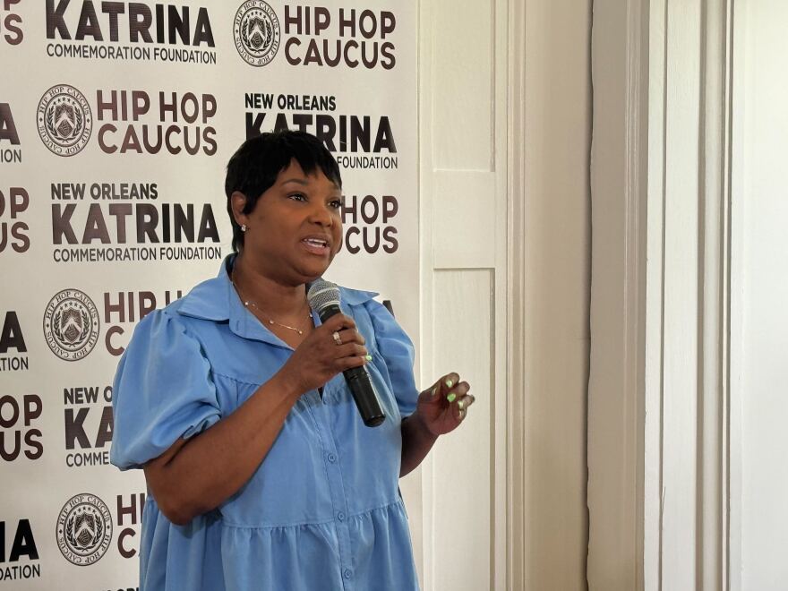 Rapper Mia X speaks at an event in observance of Hurricane Katrina.