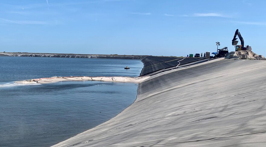 ?url=http%3A%2F%2Fnpr brightspot.s3.amazonaws.com%2Fb1%2Fb0%2F7701ce7149f0a4b35b2055a05cbd%2Fpiney point may 16 dep In: State Gives Manatee Draft Permit For Deep Well Injection Of Piney Point Water | Our Santa Fe River, Inc. (OSFR) | Protecting the Santa Fe River Construction crews atop the Piney Point gypstack