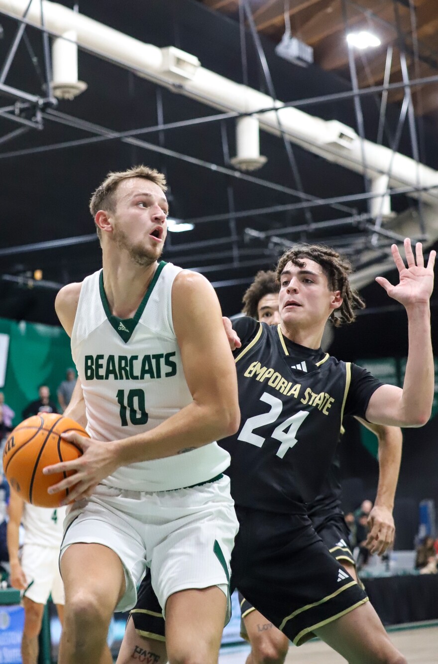 Action shot of Wes Dreamer vs Clarke basketball