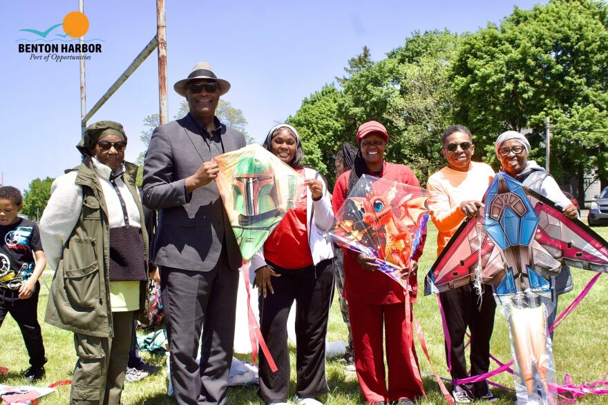 Mayor Marcus Muhammad and First Lady Abisayo Muhammad pose with participants holding kites during last year’s Benton Harbor kite flying event.