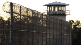 The sun sets behind Holman Prison in Atmore, Ala., on Thursday, Jan., 27, 2022, as the U.S. Supreme Court considered whether to allow the execution of death row inmate Matthew Reeves, convicted of killing a man during a robbery in 1996. (AP Photo/Jay Reeves)