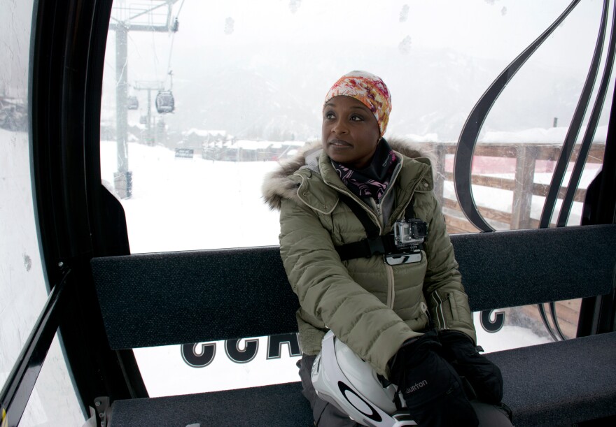 Snowboarder Sophia Stallworth of Tampa, Fla., takes the gondola to a blue run Wednesday. Stallworth joined the National Brotherhood of Skiers four years ago. When she first tried skiing, she says, "I didn't see people who looked like me." As youth director for Tampa's Onyx Club, she works with underprivileged children to develop their interest in outdoors sports.