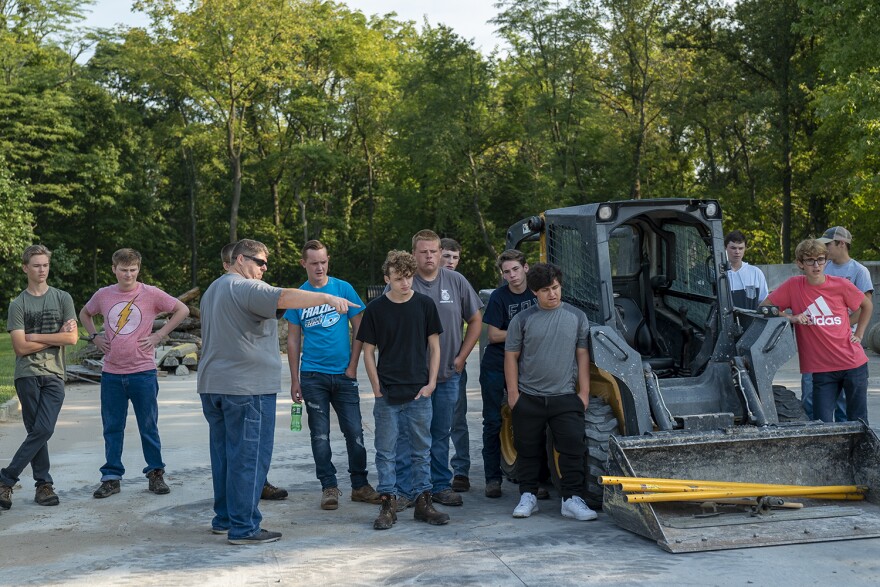 Instructor Jason Jackson explains the different challenges of pouring concrete to his class on Sept. 10.