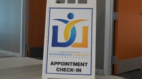 sandwich board sign reading Hamilton County Developmental Disabilities Services appointment check-in