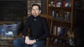 Cancer survivor Jim Nace poses in his Ballwin, Missouri, home.