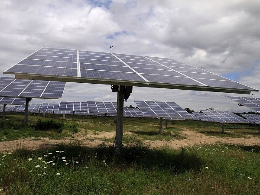 Solar trackers installed in South Burlington in a field on a cloudy day are pictured in this July 27, 2011