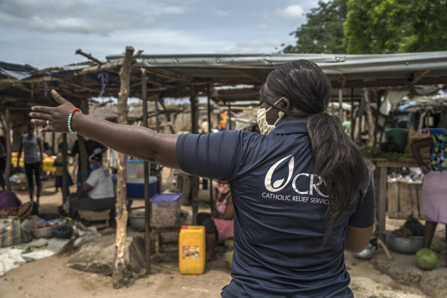 Since the COVID pandemic began, Baltimore-based Catholic Relief Services has reached 21 million people worldwide via on-the-ground efforts, like this sanitation and hygiene field project at the Pwalugu Market in Ghana, West Africa, to slow the spread of COVID-19 and bolster the capacity of local health responders.