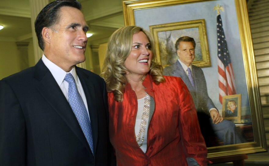Former Massachusetts Gov. Mitt Romney and his wife, Ann, greet guests after his official portrait is unveiled in 2009 during a ceremony on the Grand Staircase at the Statehouse in Boston.