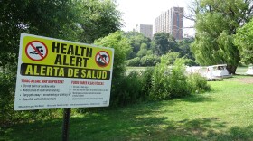Signs warn the public to beware of the water.