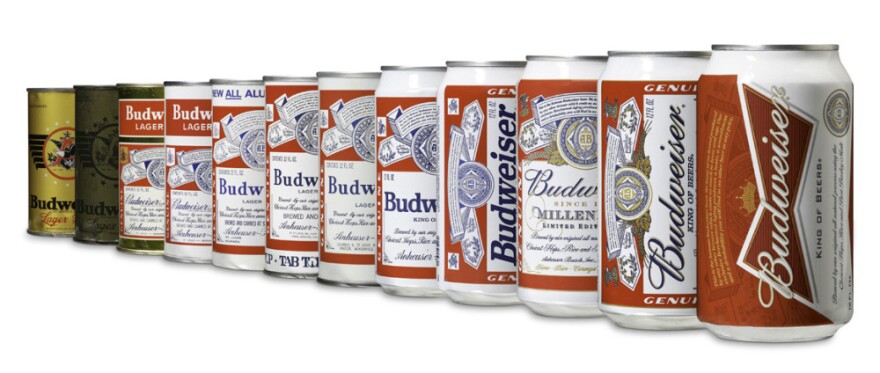 <strong>The 12 Cans Of Budweiser</strong>: Bud's new design (far right) emphasizes a bow tie. A 1940s version for soldiers (second from left) used olive drab, presumably to blend into combat situations.