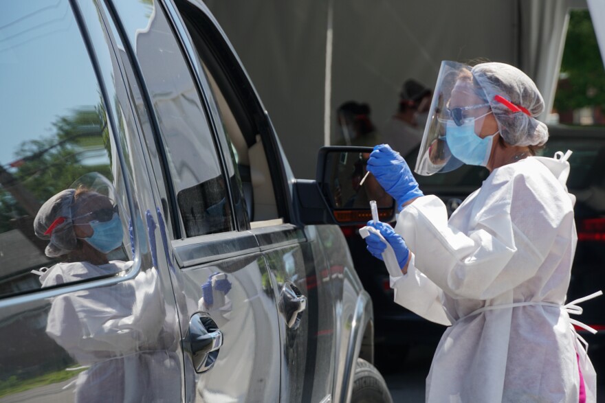 Nurse Michelle Radomski finishes giving someone a coronavirus nasal swab test at Affinia Healthcare's South Broadway location on July 13.