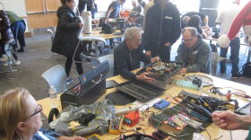 A busy Fixit Clinic with many projects in mid-repair