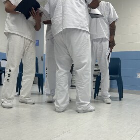 Participants in the RTA program rehearse the poem provided by the course.