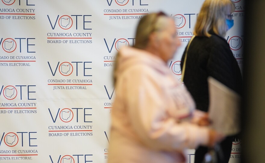 People vote early in-person at the Cuyahoga County Board of Elections on Oct. 27, 2022.