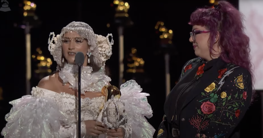Sierra Ferrell accepts one of her four Grammy Awards on Sunday, here with Melody Walker, who shared the Best American Roots Song for "American Dreaming."