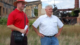 Patrick Ford (in red) and Assistant Director Marvin Six of the Brooke-Hancock Business Development Corporation at the abandoned and contaminated pottery plant in 2012.