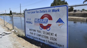 Measure C funding projects sign on a chainlink fence