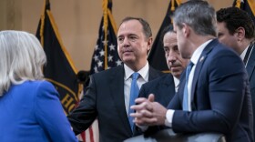 Rep. Adam Schiff, D-Calif., center, and other members of the House select committee investigating the Jan. 6, 2021, attack on the Capitol, confer with Vice Chair Liz Cheney, R-Wyo., left, during the panel's first public hearing to reveal the findings of a year-long investigation, at the Capitol in Washington, D.C.