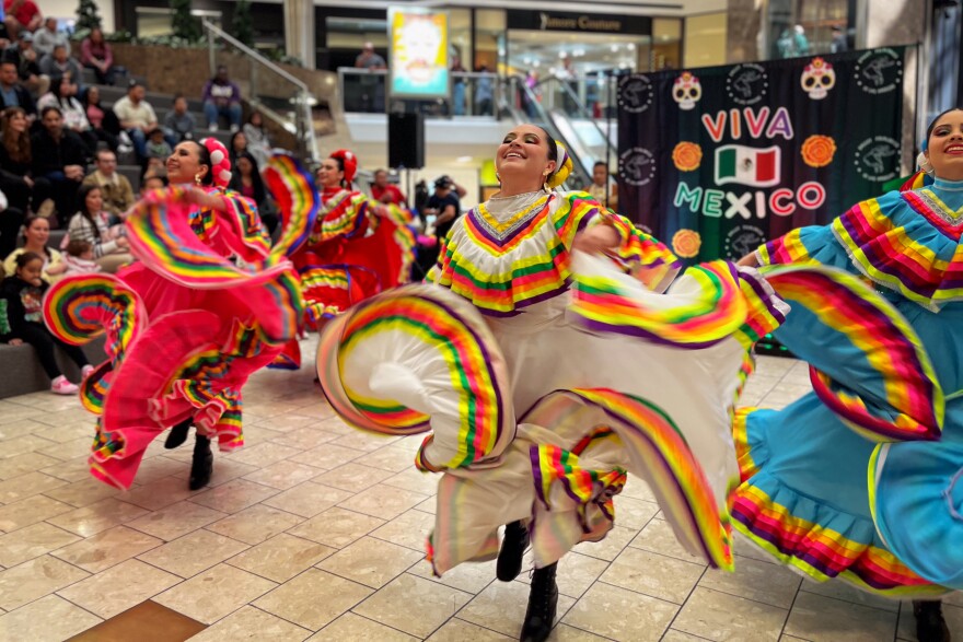 Women from the Stamford-based dance studio BFAméricas are dancing to traditional Mexican music at the Stamford Town Center for the Cinco de Mayo Celebration on May 3. When the DJ called on the crowd to cheer for their Mexican hometown, those from the Mexican state Jalisco were the most vocal, which happened to be the region from which BFAméricas's dresses were inspired.