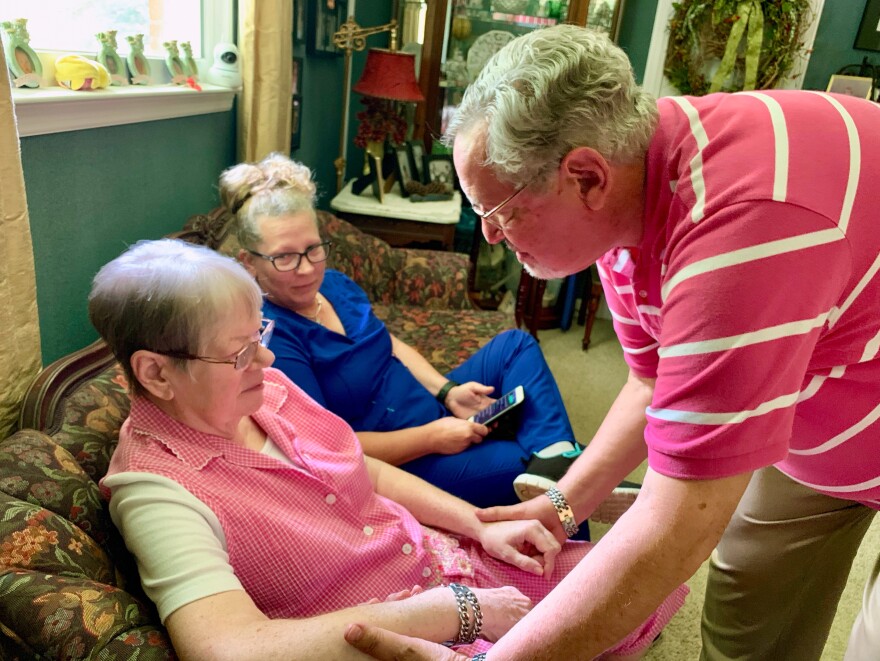 John McCasland (right) of Goodlettsville, Tenn., hired a private caregiver to help with his wife, Jean (left), who suffered from dementia for eight years. Even when hospice took over, he still found he needed the extra help from Karrie Velez (center). Jean died in October after 13 months on home hospice.