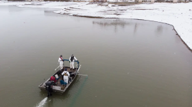 Crews with Colorado Parks and Wildlife spray mussel-killing chemicals into Highline Lake near Loma on March 1, 2023. Zebra mussels are an invasive species. They were detected at Highline Lake last September, marking the first time they were found in a body of water in Colorado.