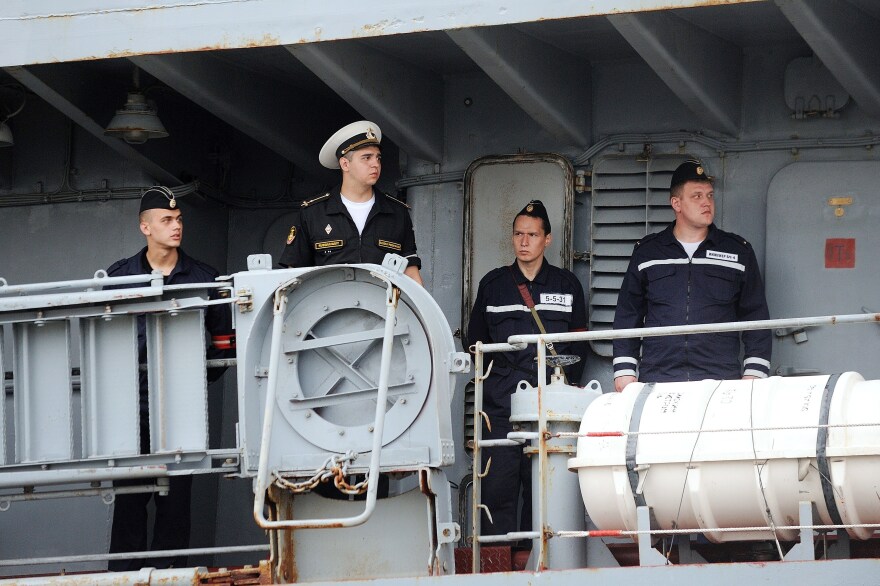 Russian sailors arrive in St. Nazaire aboard the Smolniy on June 30. They are among the 400 Russian sailors who will train on the Vladivostok — and sail the ship back to Russia.