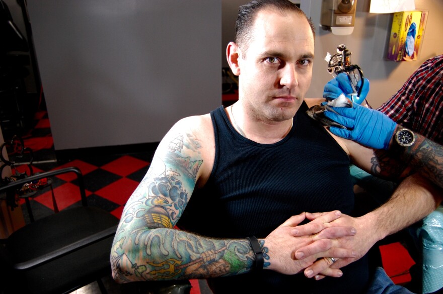 Navy Petty Officer First Class Mike Spittler already has a nautical scene tattooed on his right arm. Now, he's getting a new tattoo on his left.