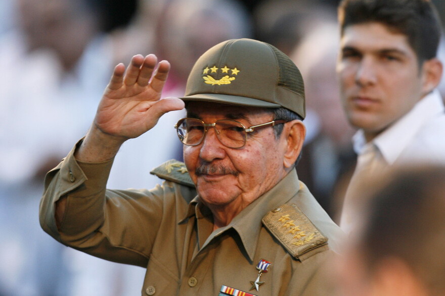 FILE - Cuba's acting President Raul Castro waves to journalists in front the Museum of the Revolution in Havana on March 13, 2007. 