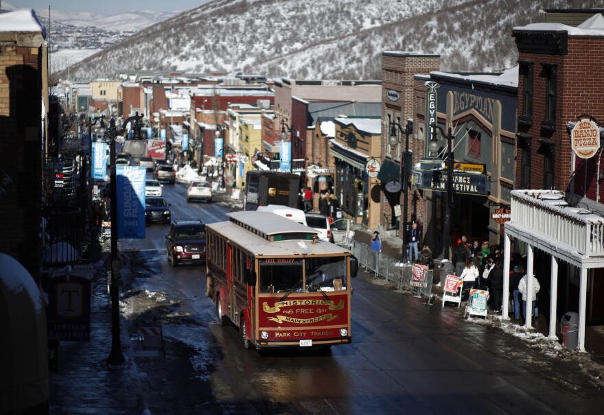 A trolley drives along Main Street during the Sundance Film Festival in Park City, Utah on Thursday, Jan. 20, 2011. (AP Photo/Danny Moloshok)