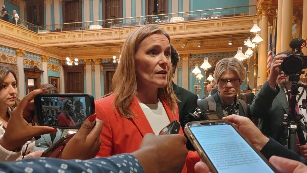 Michigan Senate Majority Leader Winnie Brinks (D-Grand Rapids) speaks to reporters early Wednesday morning after legislators approved a stopgap spending bill that narrowly averts a partial state government shutdown.