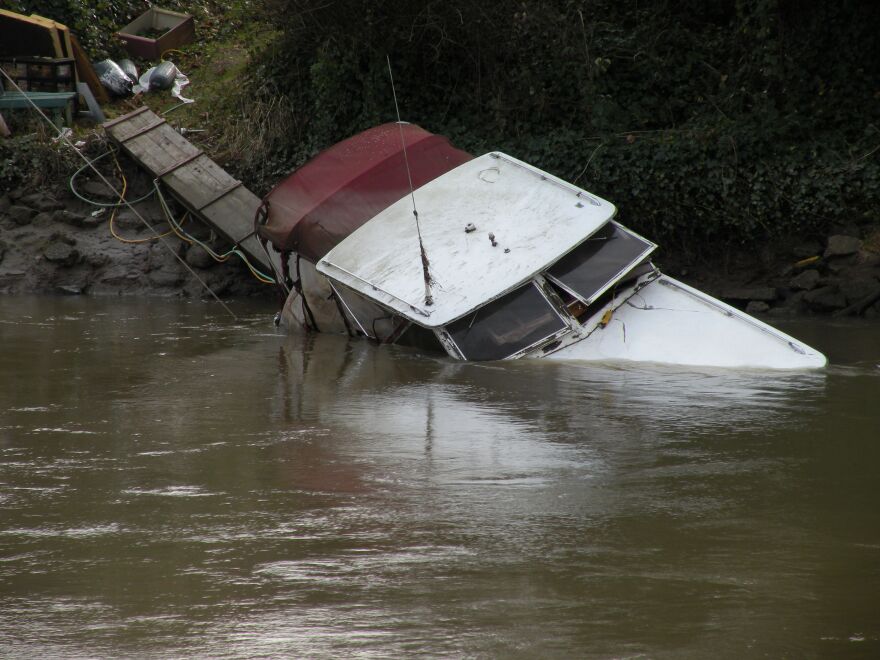 This adandoned boat sank in the Duwamish River in Tukwila about two months ago. DNR says the city is going through the required process of trying to notify the boat's owner. If the owner doesn't deal with the boat by mid-February, the city will take over.