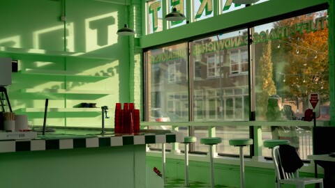 A man peers through the window of the soon-to-be-opened Ozzy’s Market on Thursday, Nov. 6, 2025, in St. Louis’ Downtown West neighborhood.