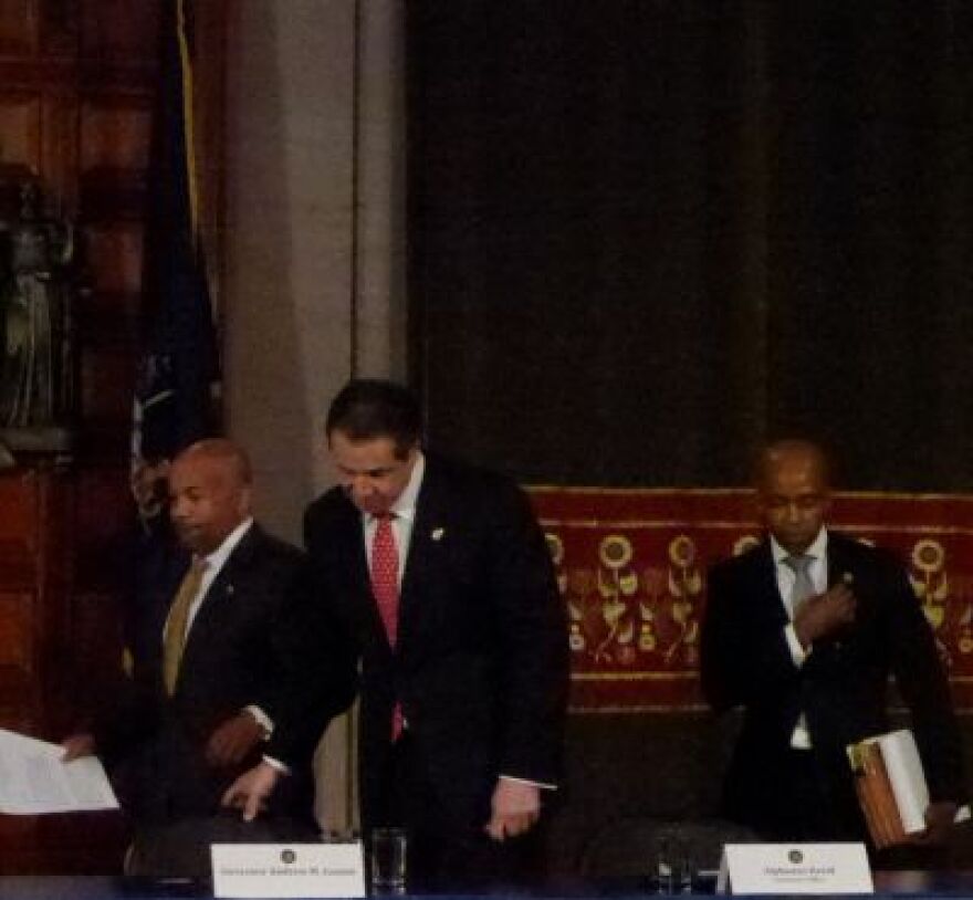 Governor Cuomo and Assembly Speaker Carl Heastie enter news conference, with Cuomo's counsel Alphonso David at right.