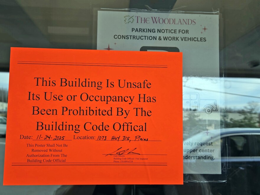 A sign on the front door of The Woodlands Inn and Resort in Plains Twp., Luzerne County, indicated that the property had been shut down for code violations.