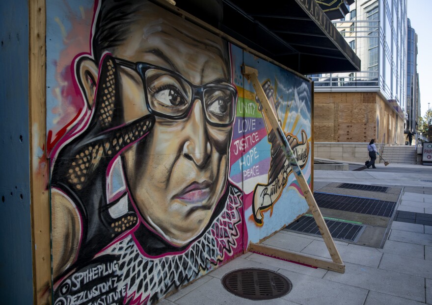 In Washington, D.C., a mural of Ruth Bader Ginsburg on boards protecting a building on I street in preparation for possible protests after the election tomorrow.