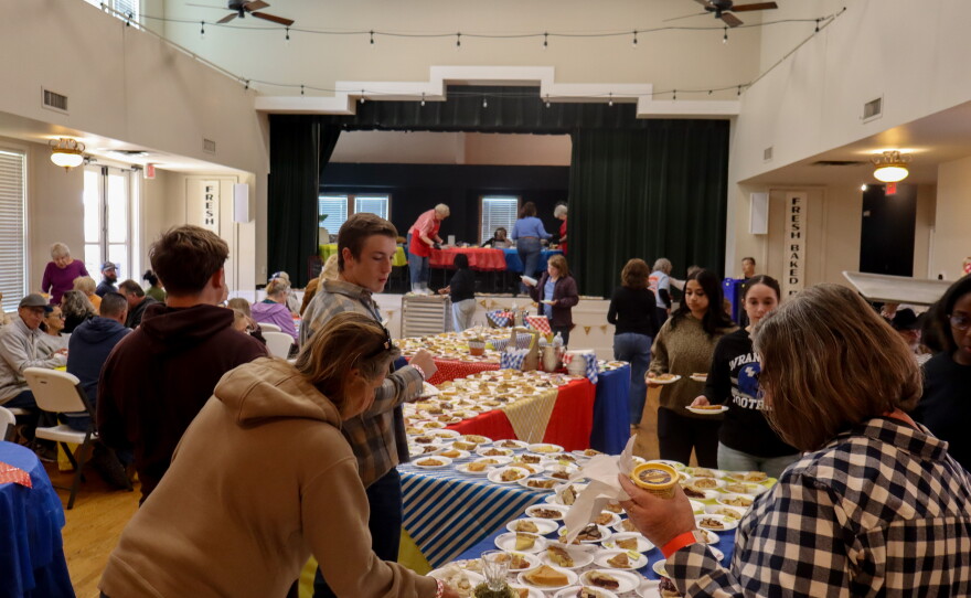 Attendees view the 40 foot pie buffet photo by Emma Coats.