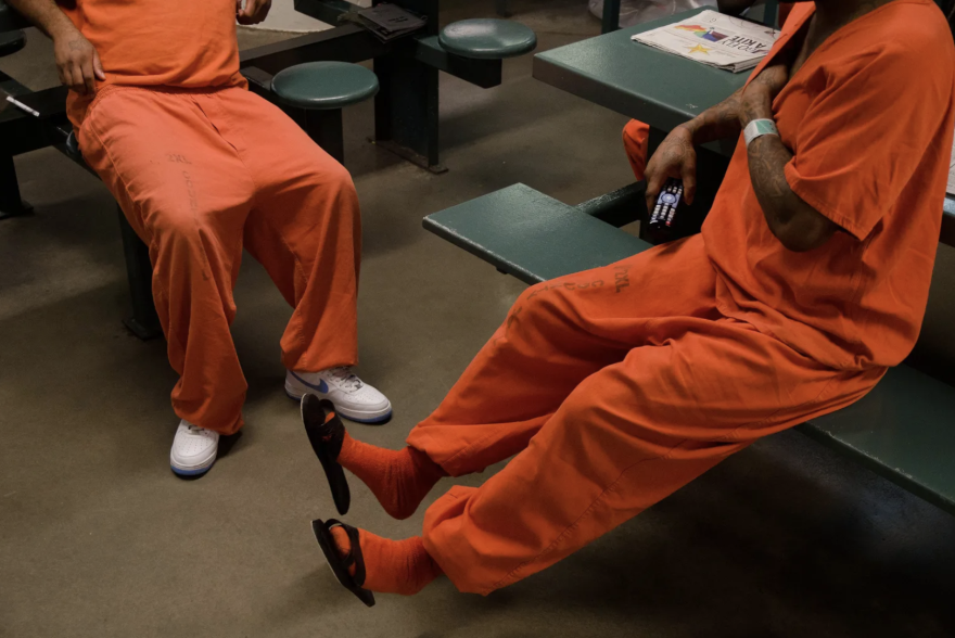 Inmates chat inside a cell block at the Harris County Jail. 