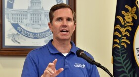 Kentucky Gov. Andy Beshear addresses a crowd gathered at the Breathitt Co. Courthouse to discuss progress in flood recovery efforts in Jackson, Ky., Friday, July 26, 2024. (AP Photo/Timothy D. Easley)