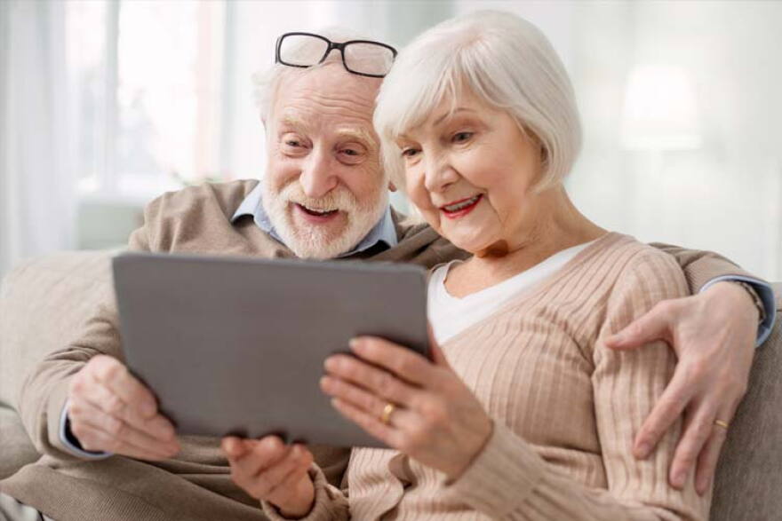 Older couple looking at tablet