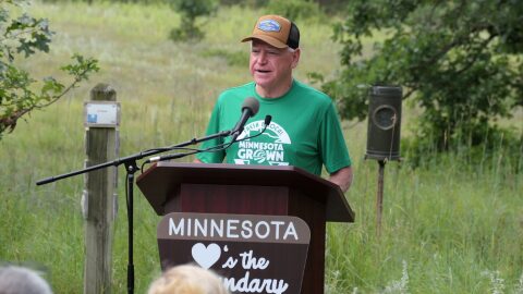 Gov. Tim Walz announces an executive order banning nonferrous mining near the Boundary Waters Canoe Area Wilderness at a news conference at the Belwin Conservancy near Afton State Park on Aug. 18, 2026.