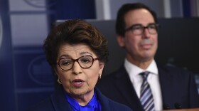 Jovita Carranza, head of the Small Business Administration, speaks as U.S. Treasury Secretary Steven Mnuchin listens during a news conference on April 2. The SBA has notified nearly 8,000 businesses that their information may have been exposed.