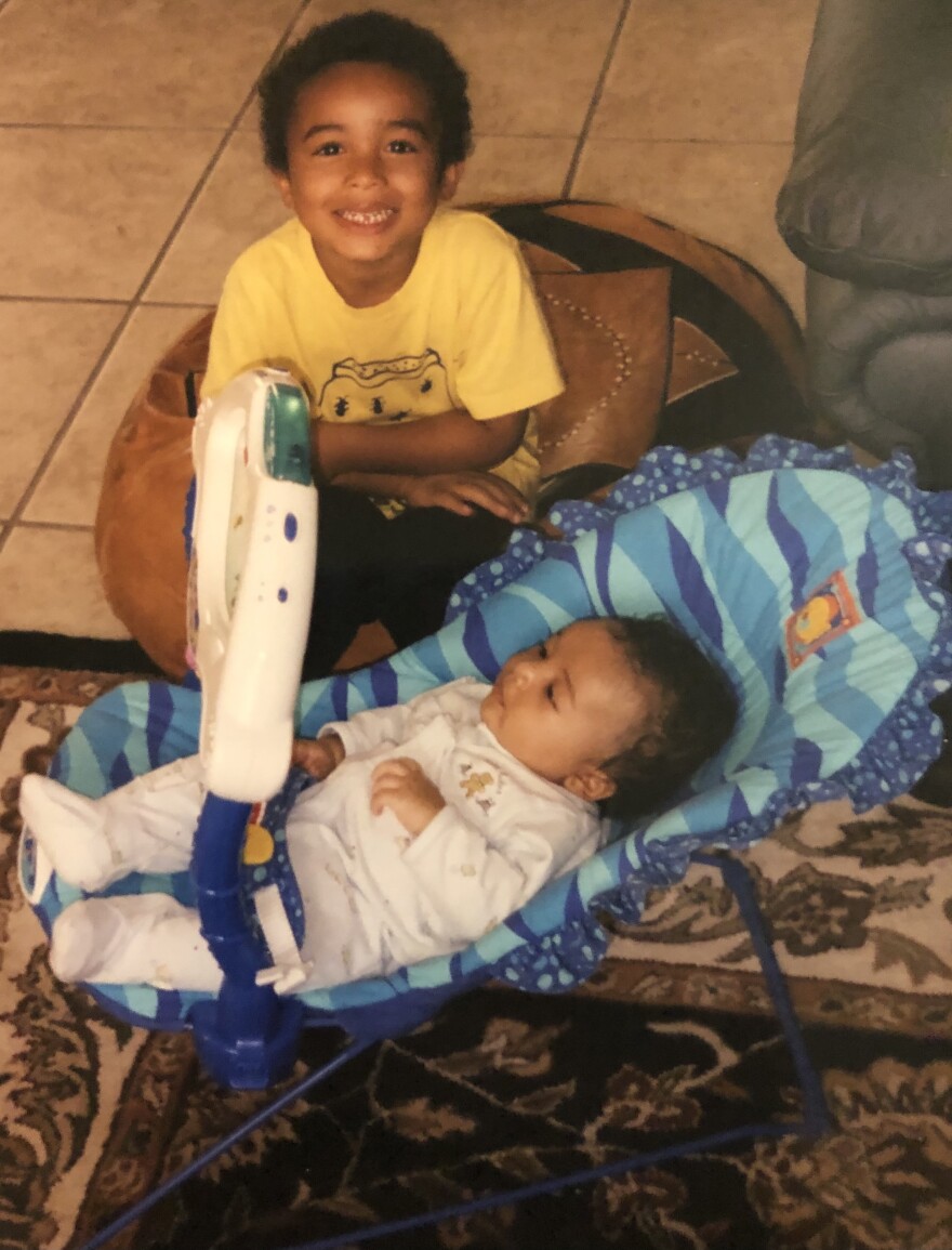 Daniel Weisberger looks over his baby brother Pascal.