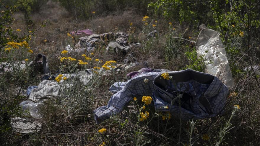 A pile of discarded clothes and debris left behind by migrants after they passed through Fitzsimons' ranch.