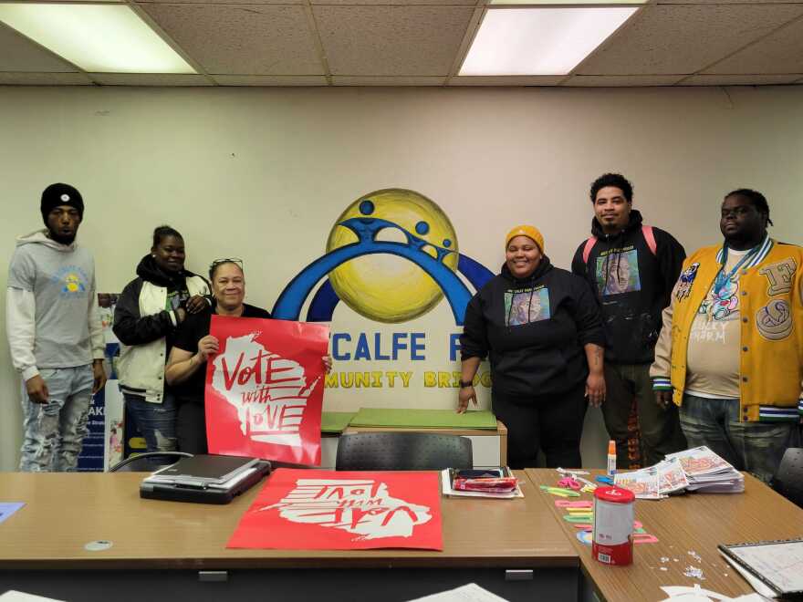 Members at Metcalfe Park Community Bridges pose in front of the newsletters they hand out to local residents. From left: James Taylor Cain, Tayla Hicks, Patrice Gransberry, Melody McCurtis, Jarrod Logan, Devell Taylor.