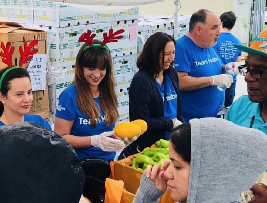 More than 400 families gather in Liberty City to receive produce and hot meals from Feeding South Florida. 